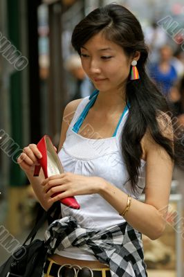 Young woman with great joy when buying shoes