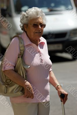 Old woman, lady crossed in a road traffic Wiener.
