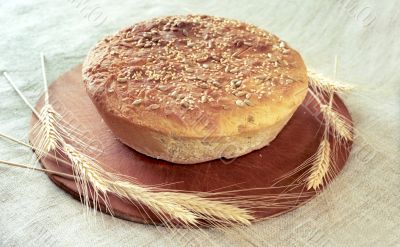 Round loaf of bread and spikes