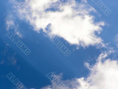 white clouds on blue