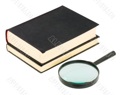 Books and magnifying glass