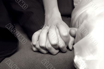 The hands of bride and groom