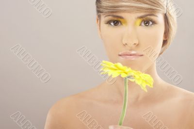 Beautiful woman with a sunflower