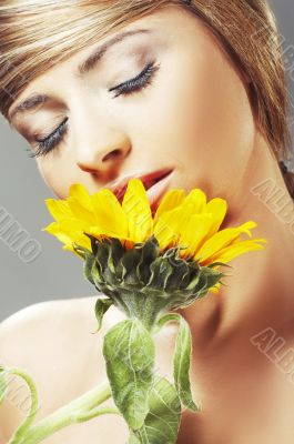 Beautiful woman with a sunflower