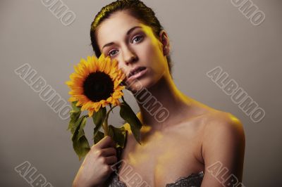 Beautiful woman with a sunflower