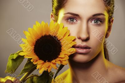 Beautiful woman with a sunflower