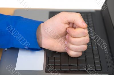 Fist on the laptop