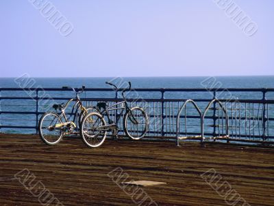 Two romantic bicycles near the ocean