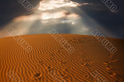 sky split over the desert sand