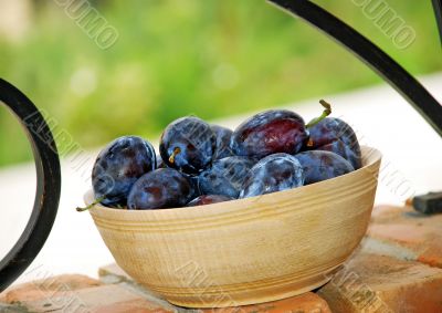 Plums wooden bowl