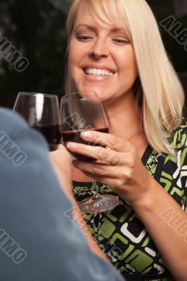 Blonde Socializing with Wine Glass