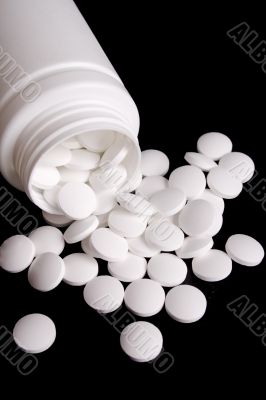 bottle with white pills