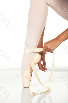 Tying ballet shoes