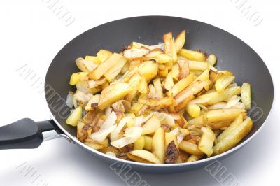 fried cutting potatoes in griddle closeup