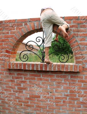 Escape over brick wall