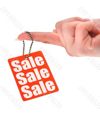 hand holding sale tag