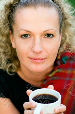 woman holding a cup