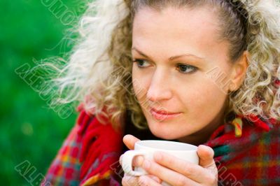woman holding a cup