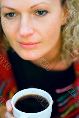 woman holding a cup