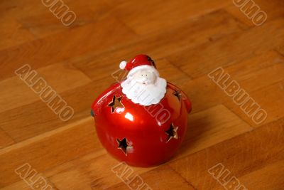 Christmas candlestick on parquet floor