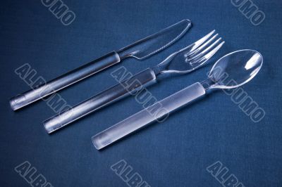 Plastic cover set on blue textile background