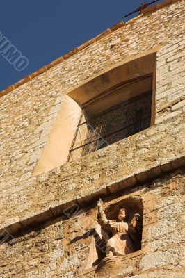 Building with window and statue