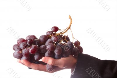 Hand with grape