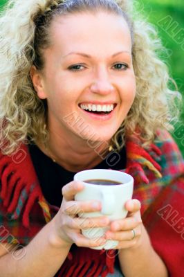 woman holding a cup