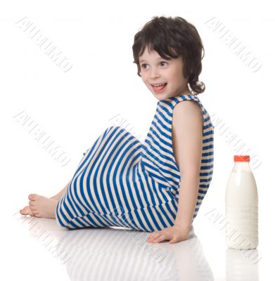 The boy with a bottle of milk