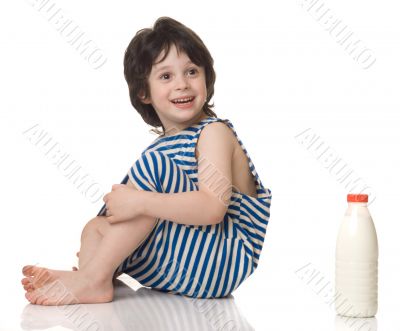 The boy with a bottle of milk