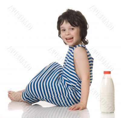 The boy with a bottle of milk