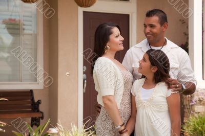 Small Hispanic Family in Front of Their Home