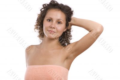 Beautiful woman wearing peach-coloured bath towel.