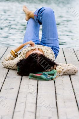woman lying near the river