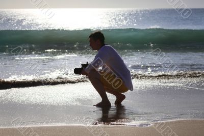 Photographer on a beach