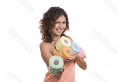 Woman wrapped in bath towel give toilet paper.