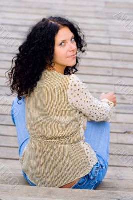 woman sitting on wooden floor