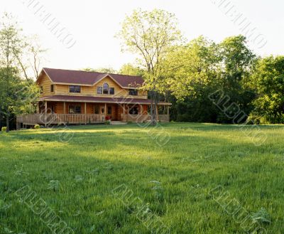 Log House with green grass