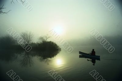 canoe on the misty waters