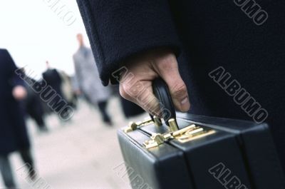 Businessman holding his briefcase