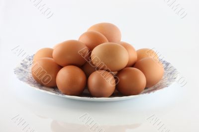 Eggs in a bowl on a white background