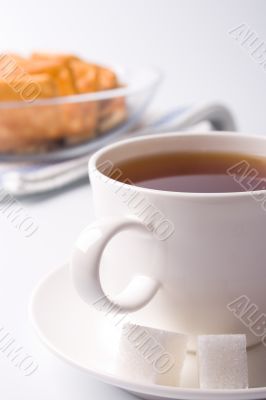 cup of tea, sugar and cookies