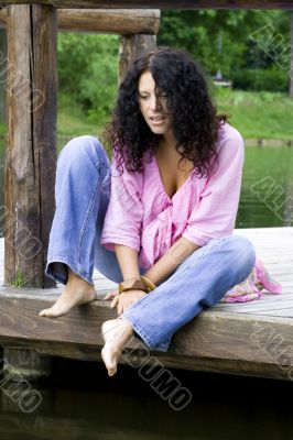  woman sitting near the water