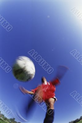 Soccer Player Kicking the Ball