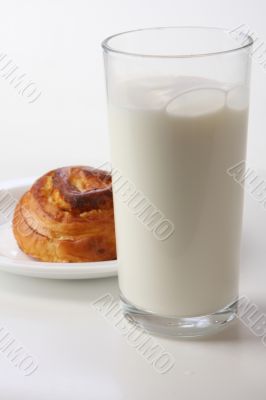 glass with milk and bun