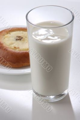 glass with milk and cheese-cake