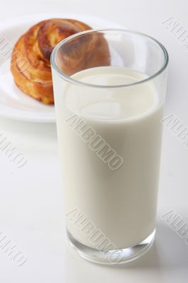 glass with milk and bun