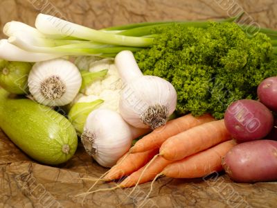 fresh tasty vegetables on brown background