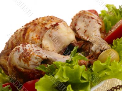 grilled chicken whole with vegetables on salad leafs