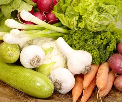 fresh tasty vegetables on brown background